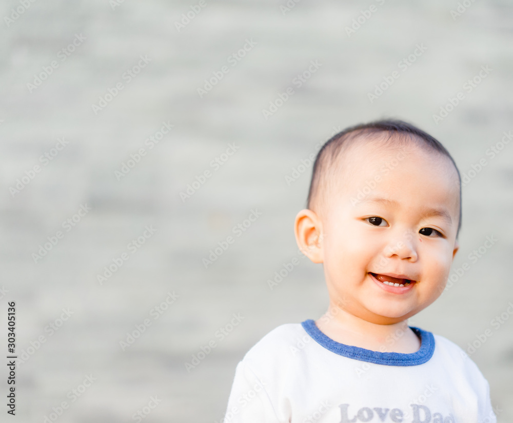 Happy Little asian baby boy child showing front teeth with big smile and laughing: Healthy happy funny smiling face young adorable lovely kid.Joyful portrait of asian elementary preschool. Happy Little asian baby boy child showing front teeth with big smile and laughing: Healthy happy funny smiling face young adorable lovely kid.Joyful portrait of asian elementary preschool.