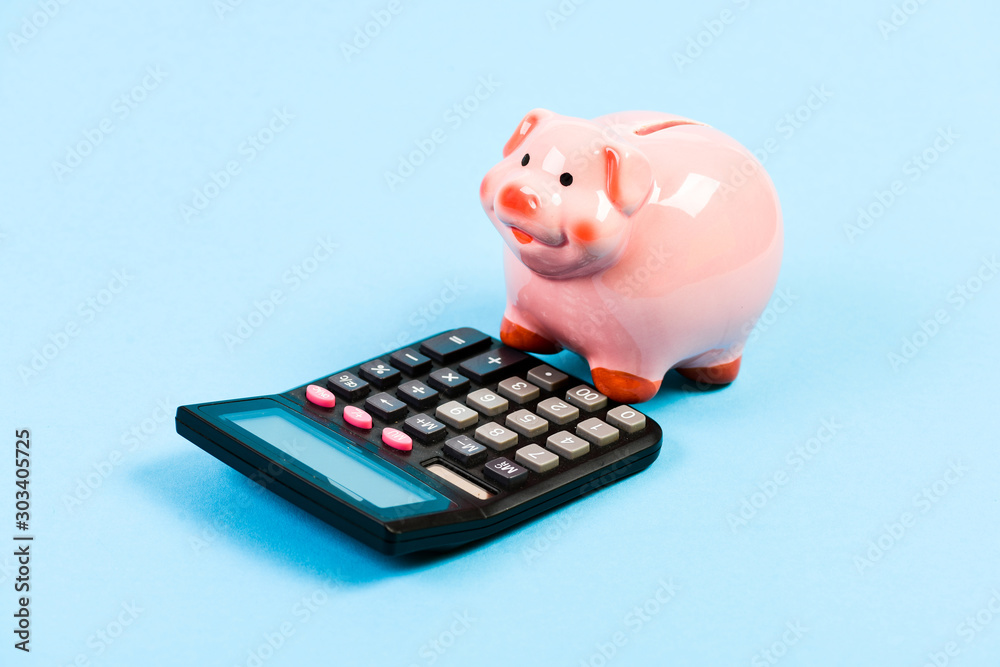 moneybox with calculator. Piggy bank. planning and counting budget. bookkeeping. financial problem. income capital management. money saving. Accounting and payroll. social help moneybox with calculator. Piggy bank. planning and counting budget. bookkeeping. financial problem. income capital management. money saving. Accounting and payroll. social help