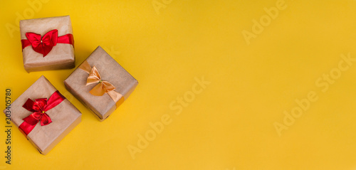 Banner - Christmas and New Year's gifts on a yellow background with copy space. Banner advertising.