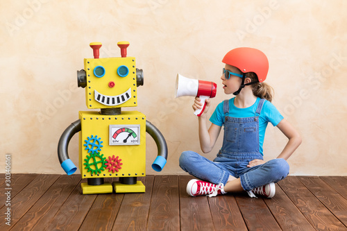 Happy child with toy robot