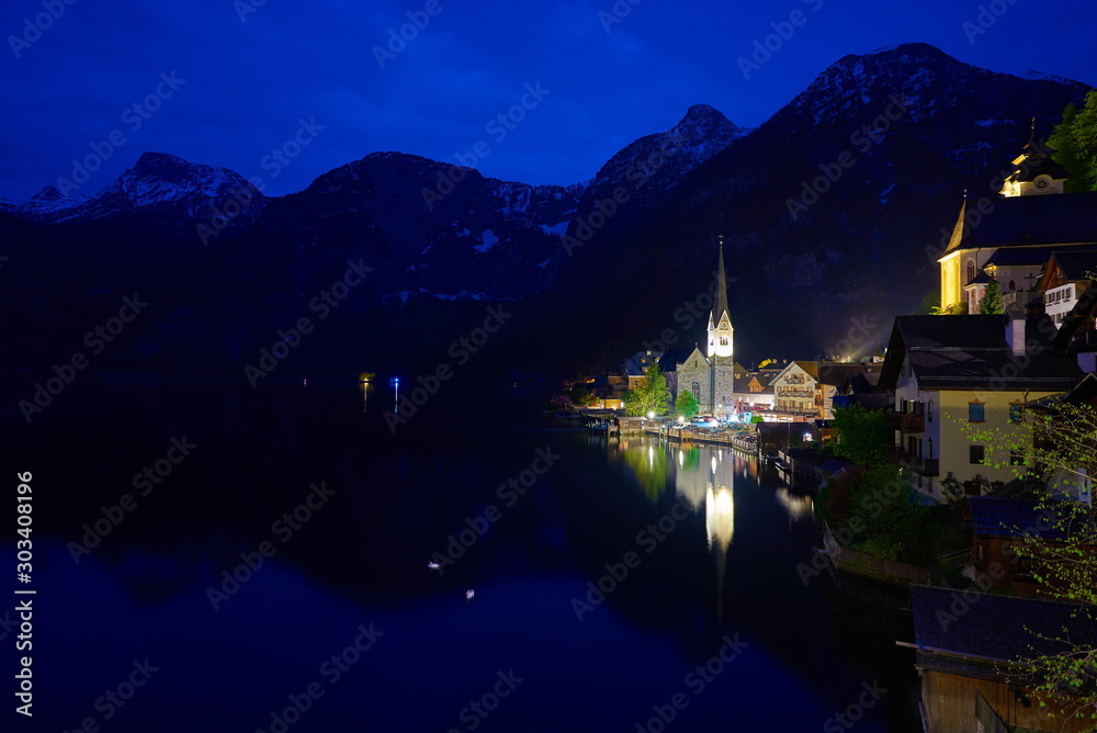 Beautiful night landscape of Hallstatt mountain village with Hallstatter lake in Austrian Alps.