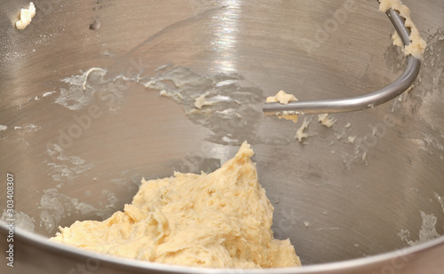 Mixing Pizza dough in multifunction machine. Close-up.