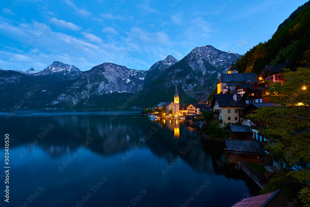 Beautiful night landscape of Hallstatt mountain village with Hallstatter lake in Austrian Alps.