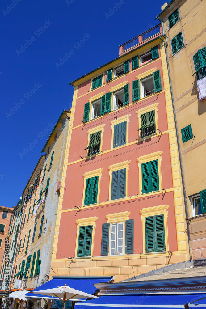 Fototapeta premium Colorful buildings at Camogli on sunny summer day, Liguria