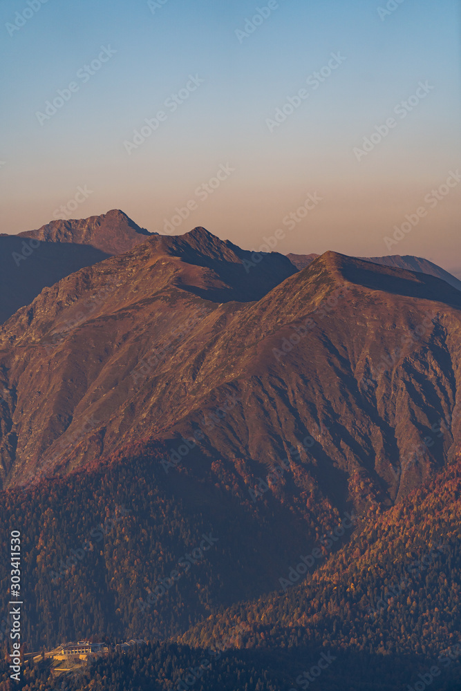 The relief of the mountains. Mountain range against the sky. Sochi Rosa Khutor