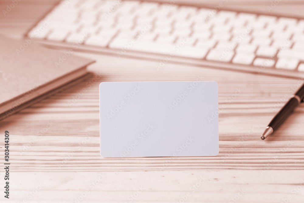 Blank credit card on office table with computer PC Blank credit card on office table with computer PC