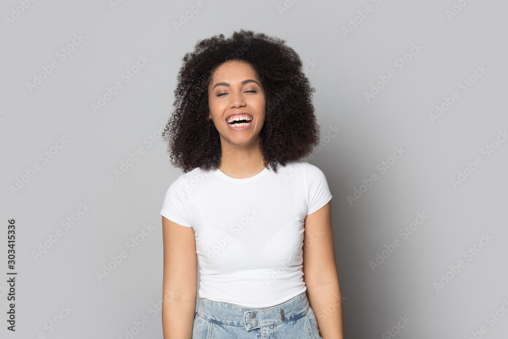 Excited African American girl laughing out loud, having fun