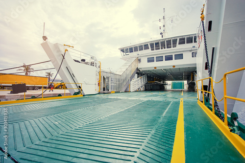 Tela Ferryboat loading or unloading by a port pier