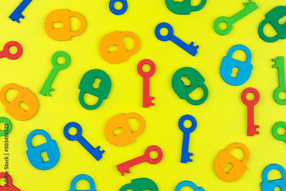 Flat lay composition with colorful felt keys and locks on bright yellow background. Flat lay composition with colorful felt keys and locks on bright yellow background.
