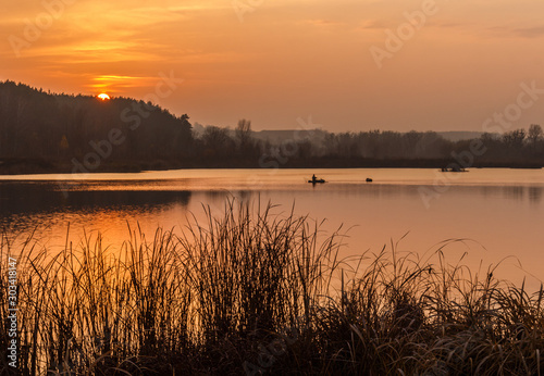 Fototapeta Naklejka Na Ścianę i Meble -  Sunset on the lake. Fishing. Fisherman. Kiev region. Ukraine.