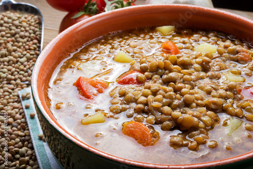 Lentil soup with tomatoes and potatoes photo