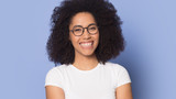 Head shot portrait happy beautiful African American girl wearing glasses