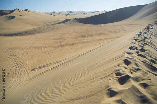 Fototapeta Naklejka Na Ścianę i Meble -  Sand dunes in la huacachina, ica desert, Peru
