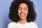 Head shot excited African American girl with closed eyes laughing