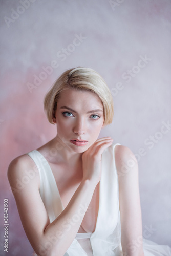 Portrait of a short-haired bride. The bride without retouching. Beauty and fashion portrait of a beautiful bride.