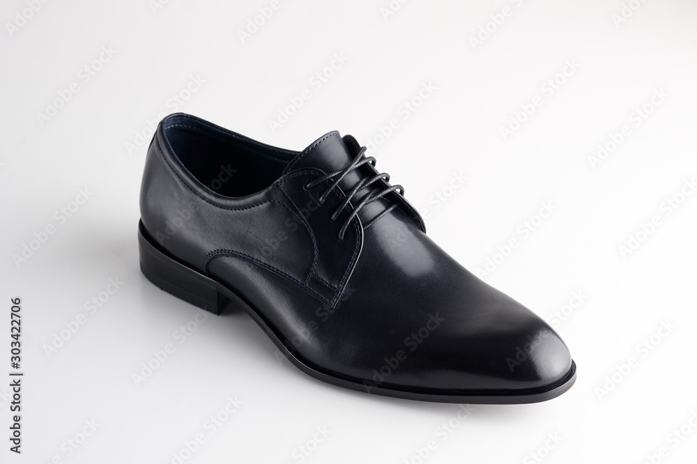 Black man leather shoe with shoelaces on white background