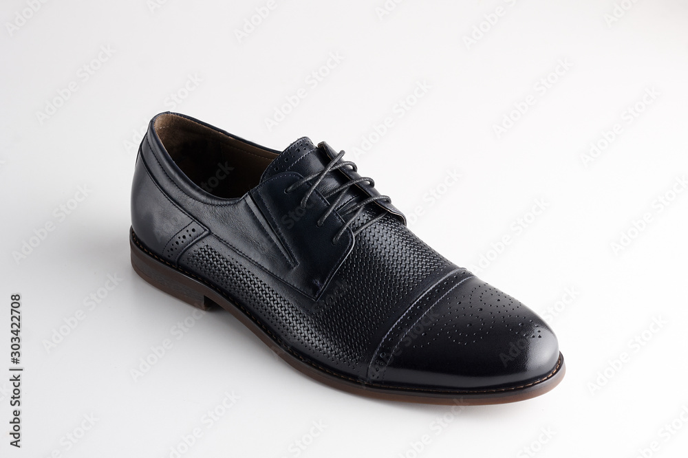 Black man leather shoe with shoelaces on white background Black man leather shoe with shoelaces on white background