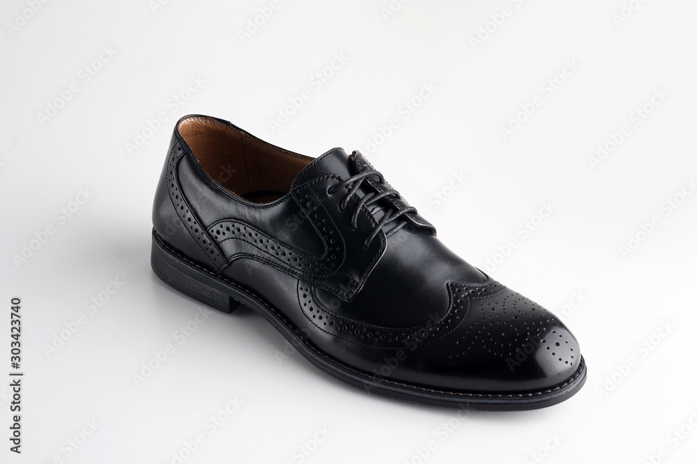 Black men leather shoe with shoelaces on white background