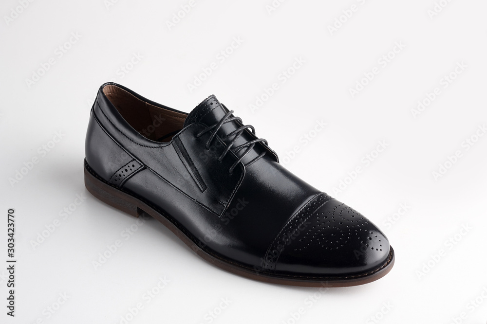Black men leather shoe with shoelaces on white background Black men leather shoe with shoelaces on white background