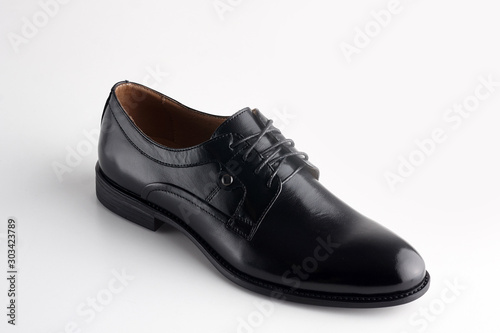 Black men leather shoe with shoelaces on white background