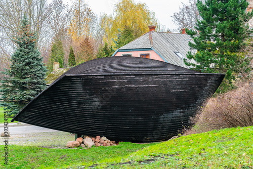 Old black big boat keel over in Grobinj in Latvia. photo