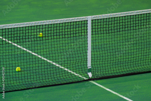 Tennis court indoor with green carpet surface