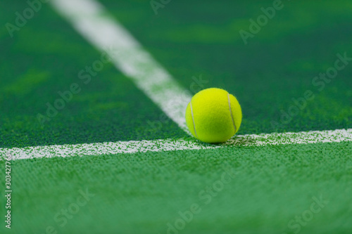 soft focus of tennis ball on tennis grass court © Augustas Cetkauskas