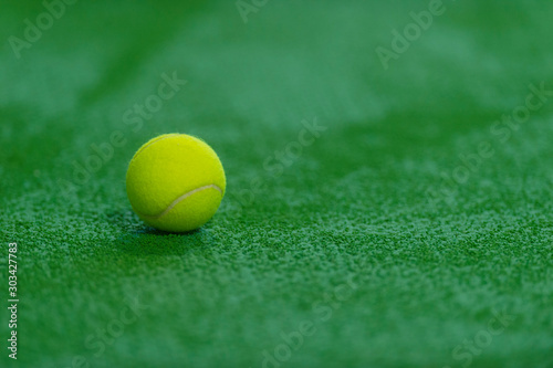 soft focus of tennis ball on tennis grass court © Augustas Cetkauskas