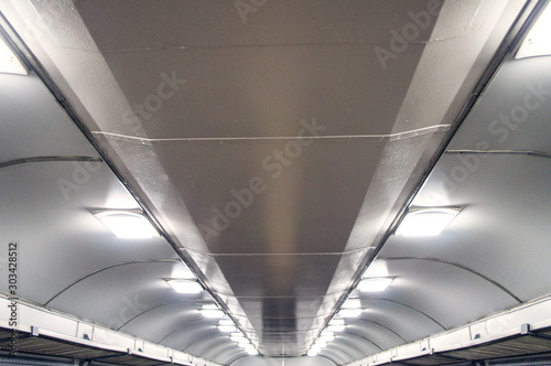 Interior of an empty train carriage ceiling view.