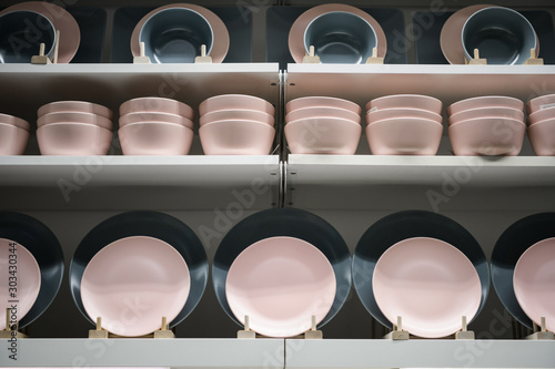 Plates Stacked on a Shelf at cookware shop.