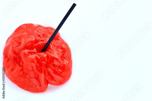 Bright red slime on white background. Education, creativity, childhood concept.