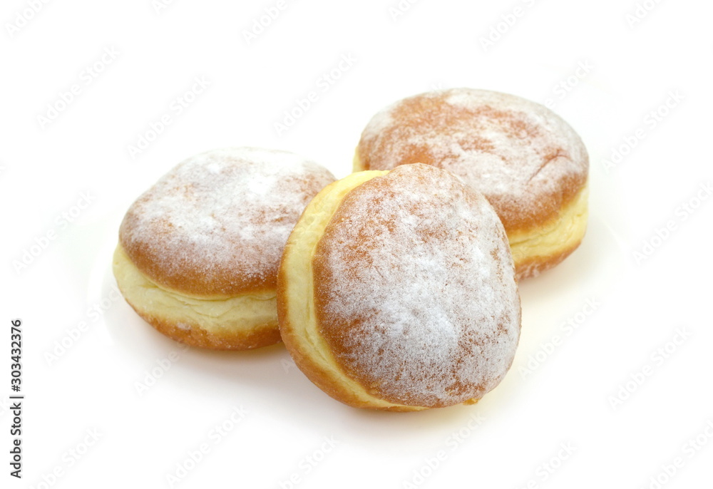 German doughnut berliner with icing sugar isolated on white. Donuts(Sufganiyah) isolated on white background one fresh baked with powered sugar. fresh dough-nut with jam. Serbian krofna German doughnut berliner with icing sugar isolated on white. Donuts(Sufganiyah) isolated on white background one fresh baked with powered sugar. fresh dough-nut with jam. Serbian krofna