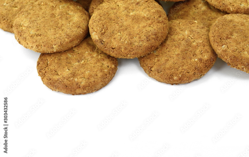 Round whole wheat biscuit, cookie with raisins isolated on white background. Biscuits with whole-wheat (wholemeal) flour isolated on white background Round whole wheat biscuit, cookie with raisins isolated on white background. Biscuits with whole-wheat (wholemeal) flour isolated on white background