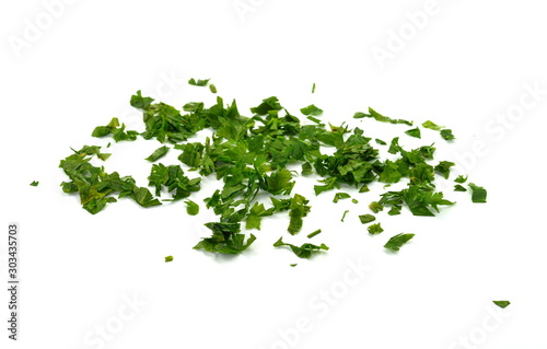Fresh green chopped parsley leaves isolated on white background and texture  top view. Chopped parsley on a white background isolated. Chopped Parsley Leaves. Fresh Herbs 