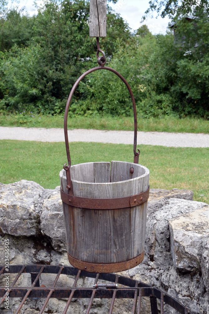Wooden Bucket Hanging over a Well 6930-042 Wooden Bucket Hanging over a Well 6930-042