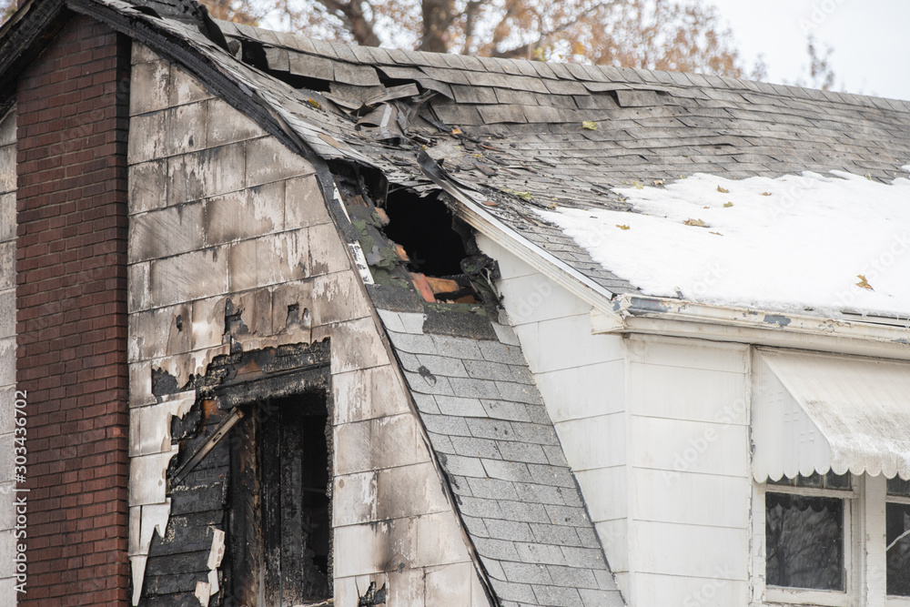 extensive roof damage from a structure fire