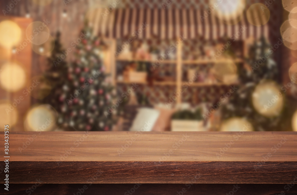Wooden desk on bokeh blur abstract christmas background
