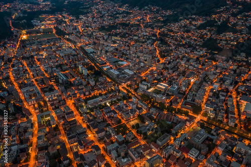 Fototapeta Naklejka Na Ścianę i Meble -  High angle aerial drone night shot of city street lights in Lugano, Switzerland