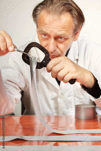 Exploring of evidence - tape used for bondage of victim photo