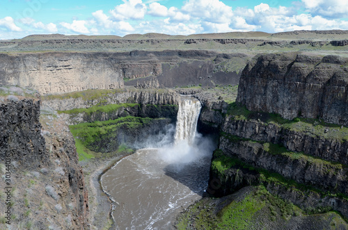 Palouse Falls surrounded by cliffs plunging into a canyon in Western Washington State, USA photo