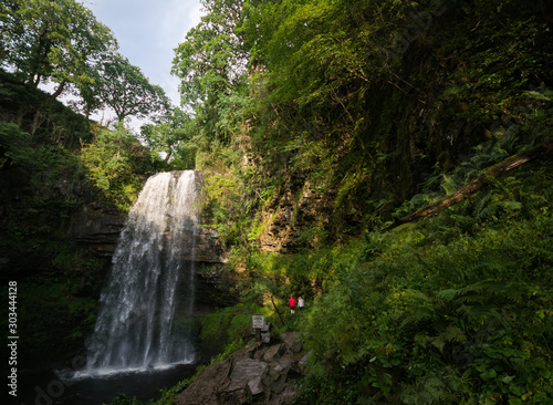 sunny day by waterfall