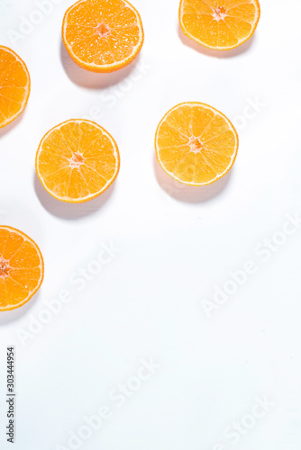 Composition with shelled Mandarin on white. Fresh peeled mandarin orange on white background. Mandarines, tangerine, clementine