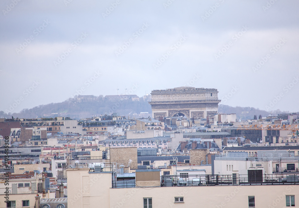 View of Parisian roofs and Arc de Triomphe