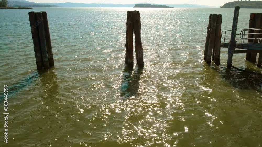 Establishing shot of Lake Trasimeno, province of Perugia, Umbria, Italy on the border with Tuscany Establishing shot of Lake Trasimeno, province of Perugia, Umbria, Italy on the border with Tuscany
