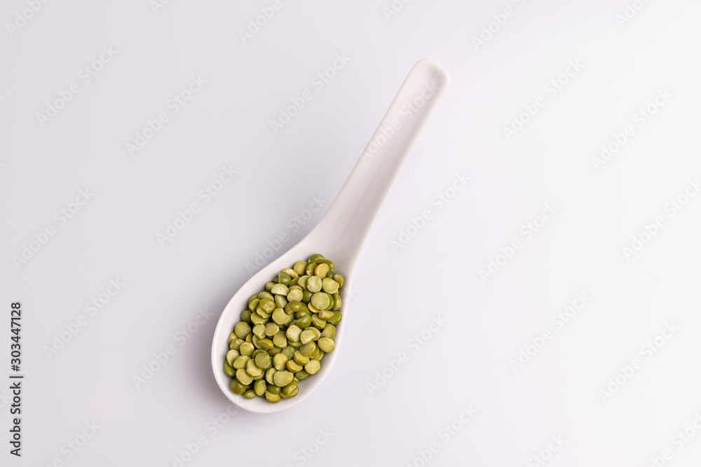 Split dried uncooked peas isolated on white background, close-up, studio shot, soft light, copy space. Christmas dish Split dried uncooked peas isolated on white background, close-up, studio shot, soft light, copy space. Christmas dish