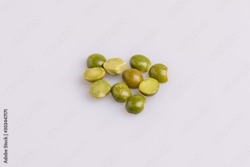 Split dried uncooked peas isolated on white background, close-up, studio shot, soft light, copy space. Christmas dish Split dried uncooked peas isolated on white background, close-up, studio shot, soft light, copy space. Christmas dish