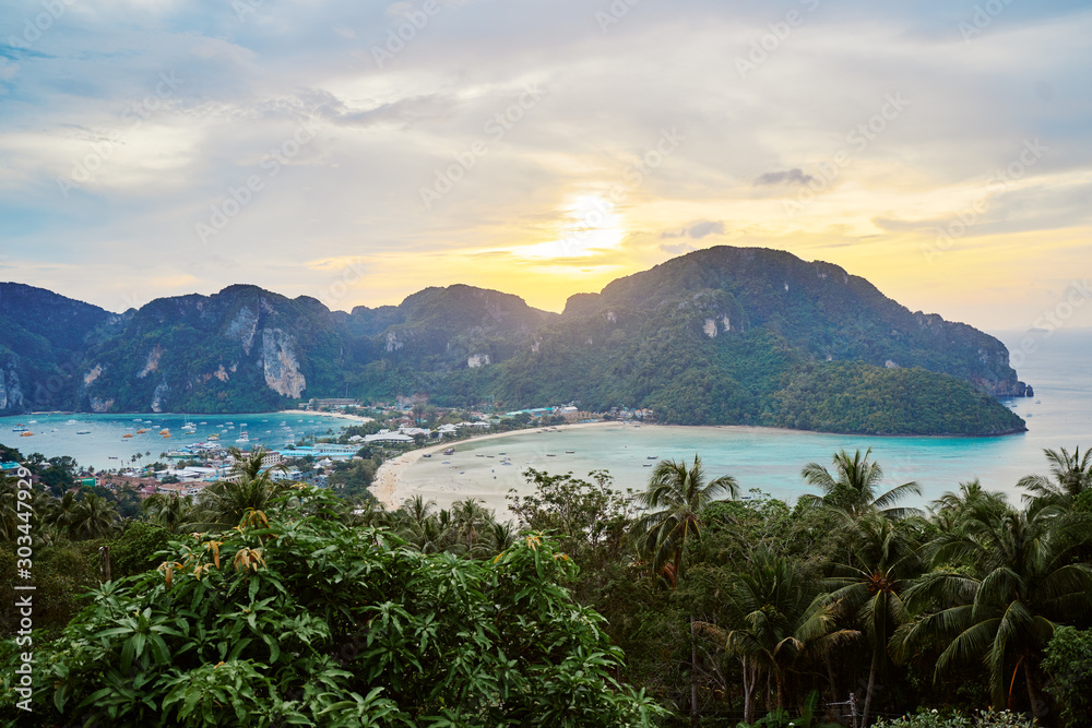 Wonderful sunset on Phi Phi Don island view point. Beautiful landscape with tropical sea lagoon.