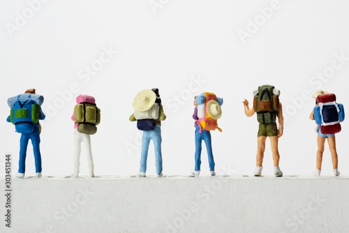 Small traveller figure for World Tourism Day background - September 27, UNWTO World Tourism Day celebration concept