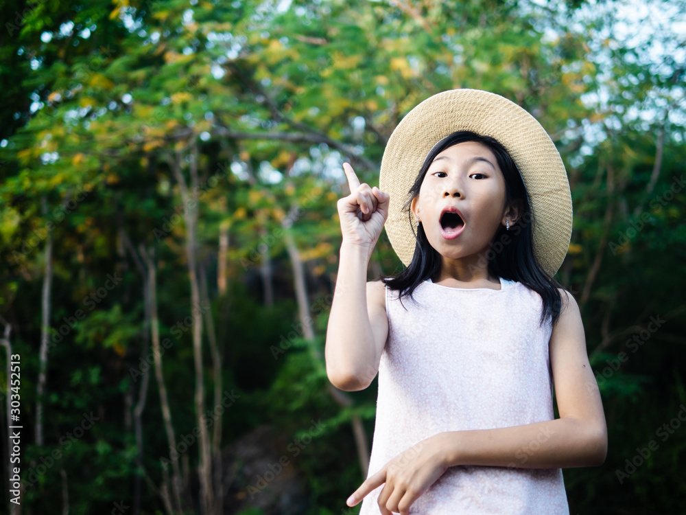 Fototapeta premium Asian girl wearing hat with nature background outdoor, lifestyle concept.