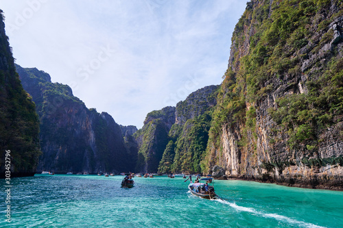 Vacation in Thailand. Phi Leh lagoon of Phi Phi Leh Island. Beautiful landscape with sea, boat and rocks. © luengo_ua